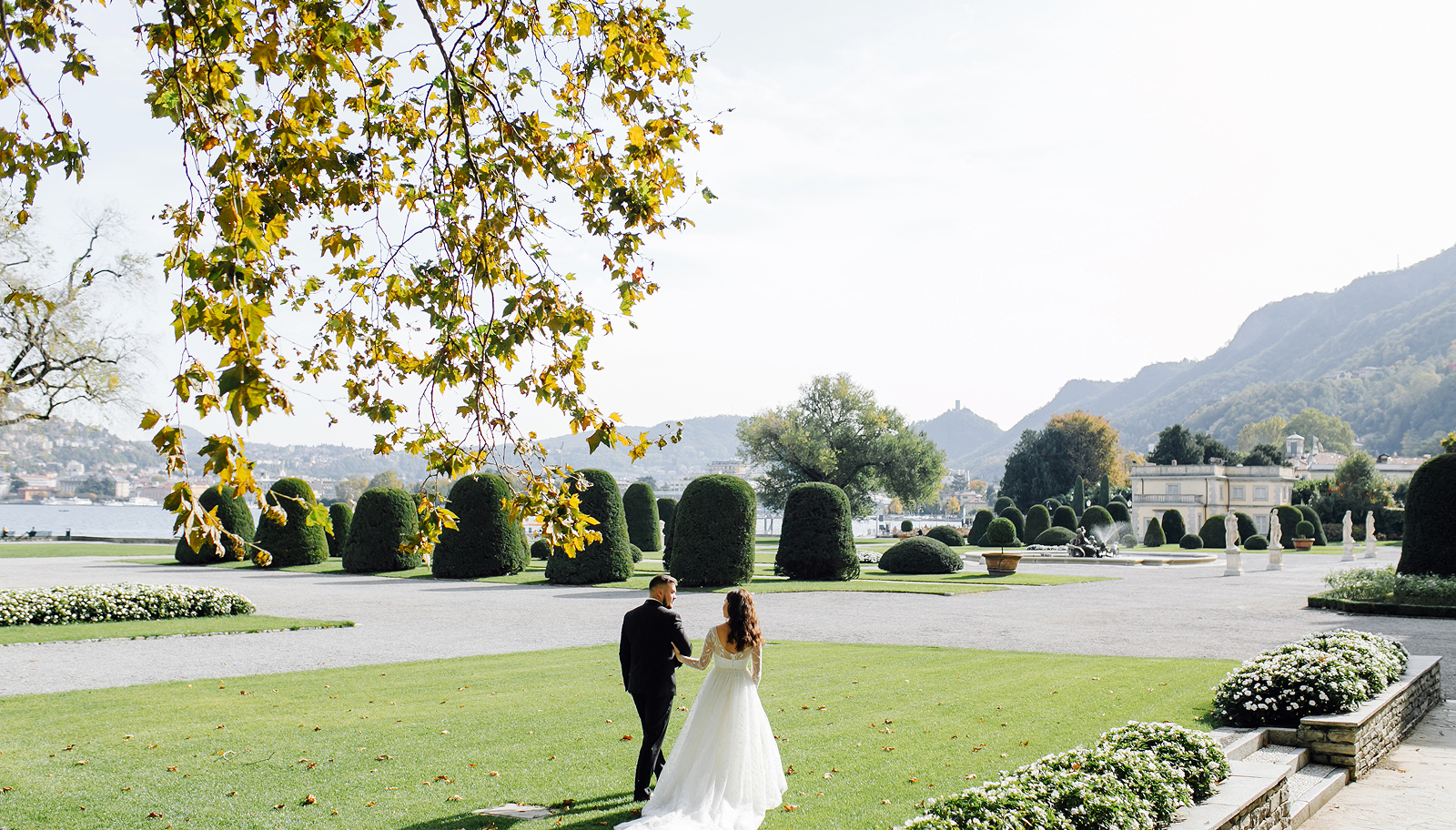 Bride and groom celebrating at an outdoor destination wedding