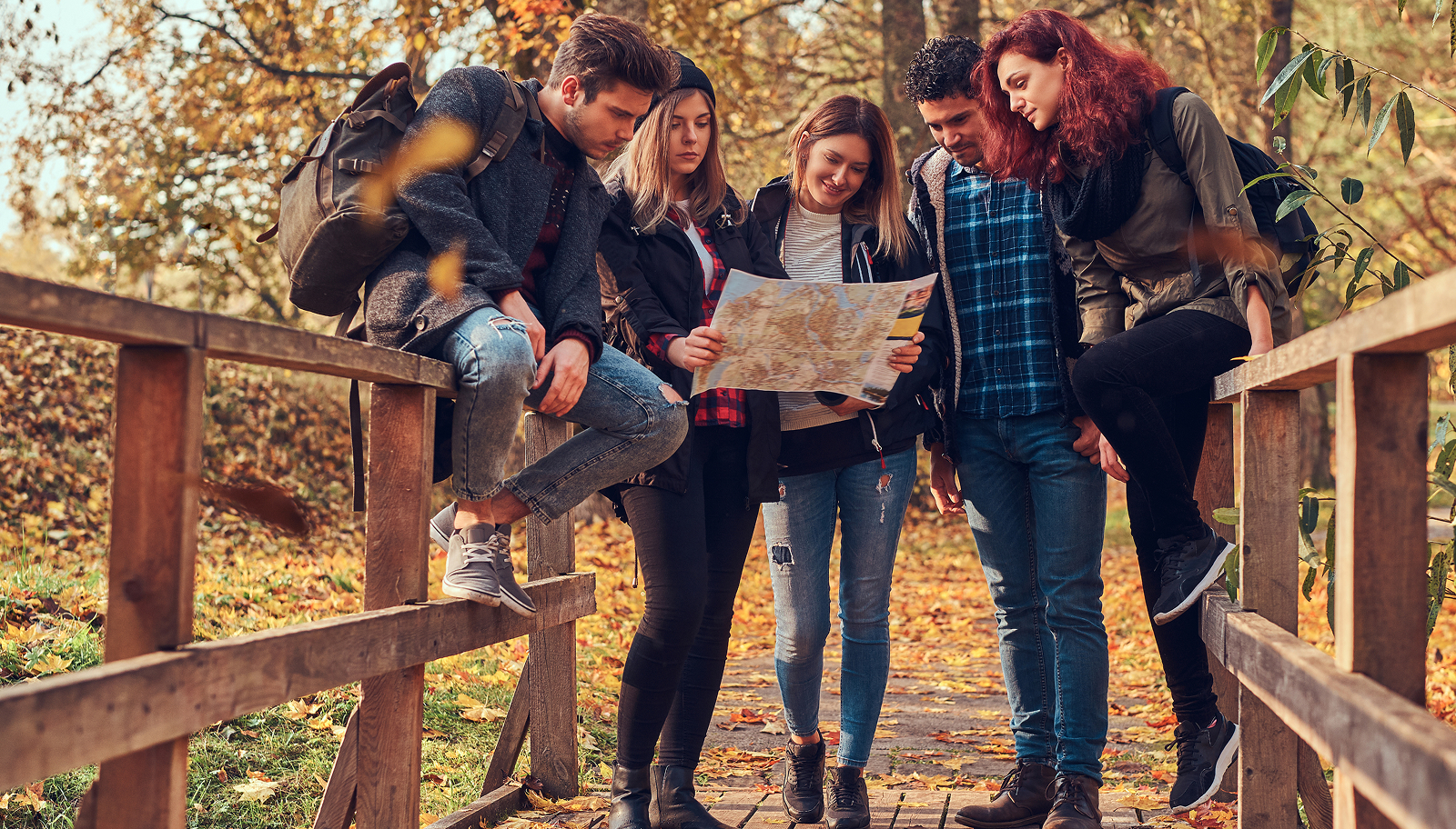 Travellers exploring a destination with a map