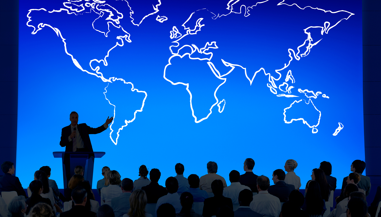 International conference presentation with a global map