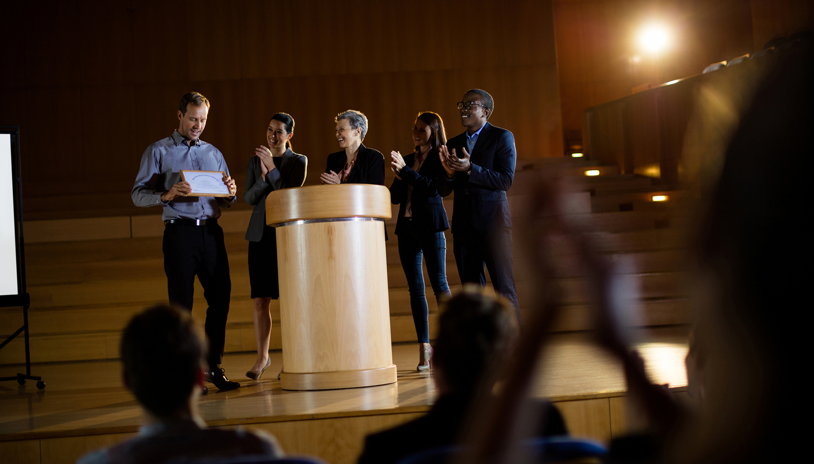 Business colleagues networking at an evening event