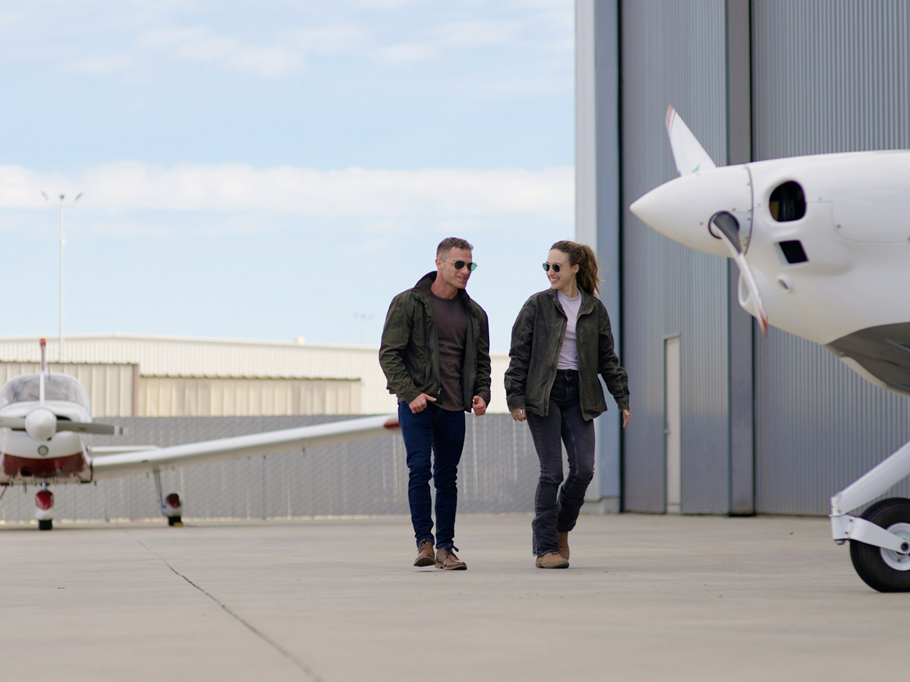 Guests arriving beside a private aircraft