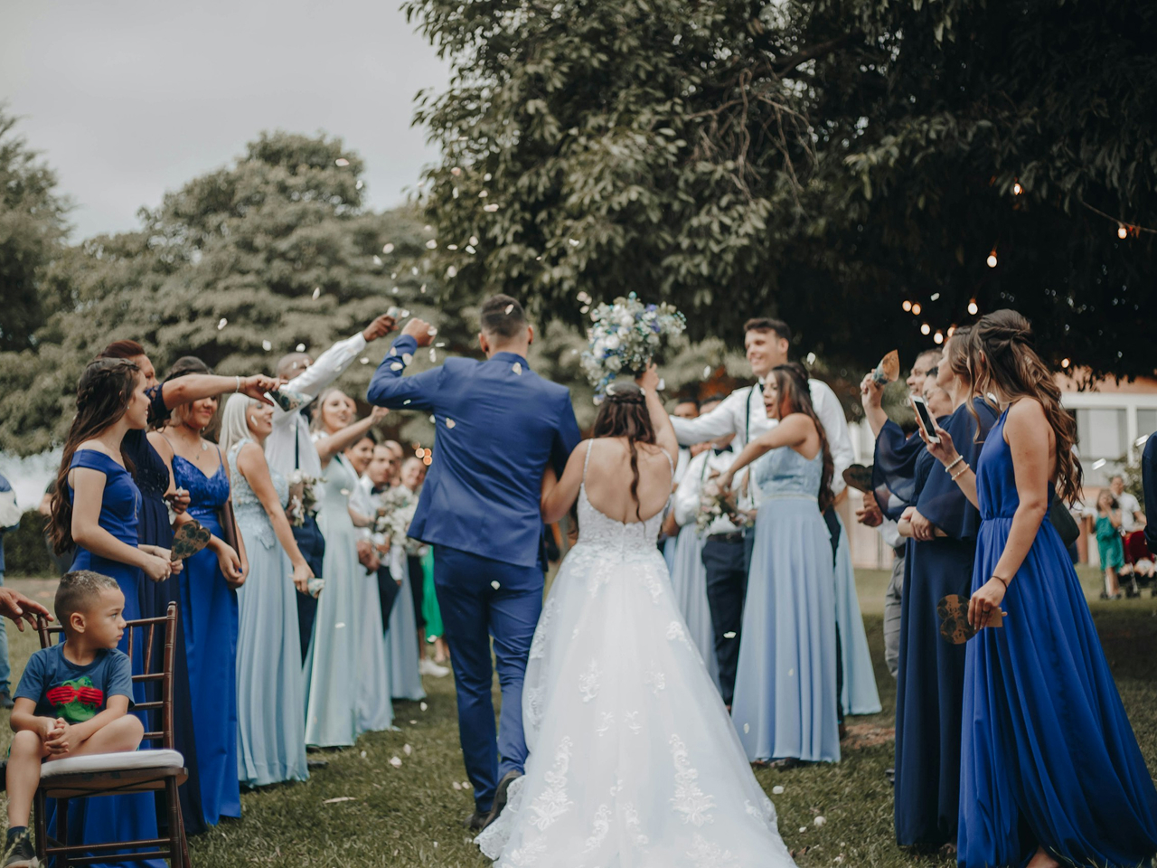 Bride and groom celebrating with their wedding party