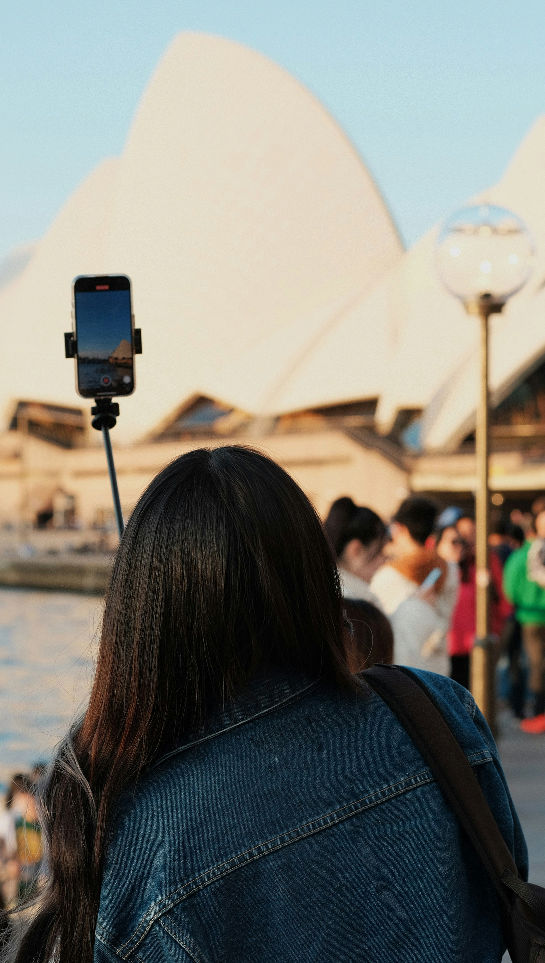 Visitor exploring the Sydney Opera House waterfront