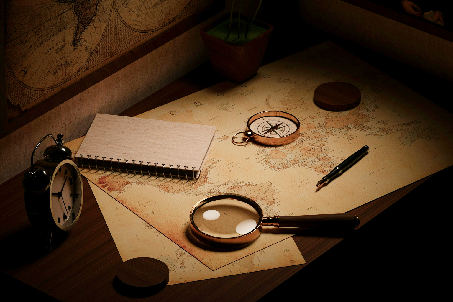 Notebook, magnifying glass and compass on a travel planning desk