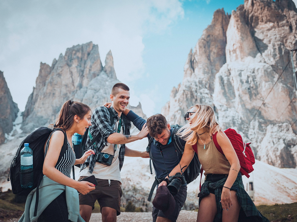 Group travellers enjoying a mountain hiking trip