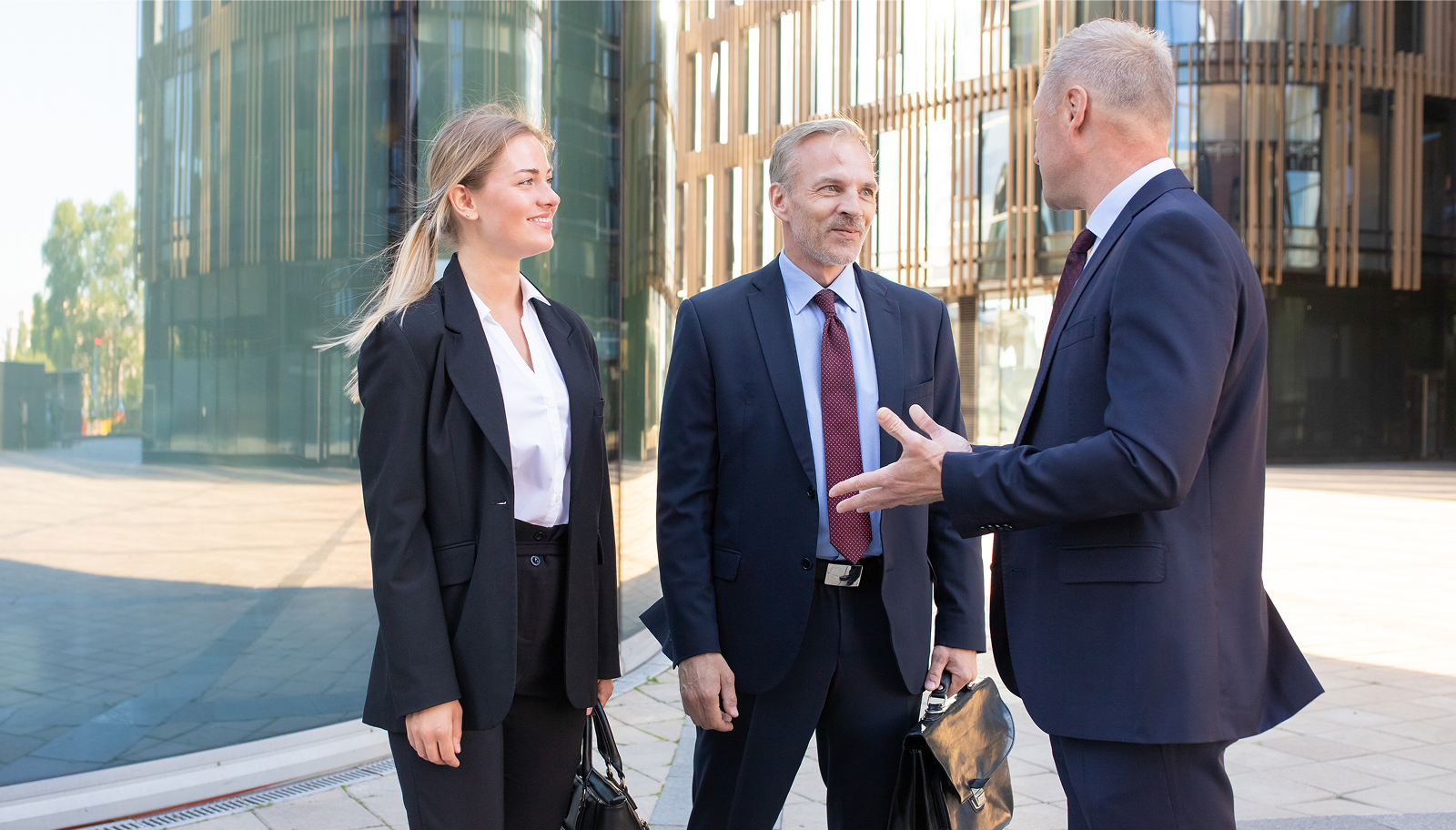 Business delegates outside an office building